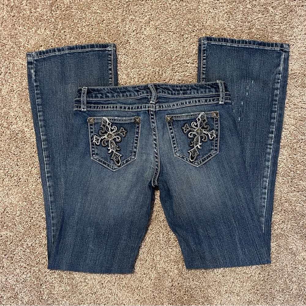 rock 47 by Wrangler ultra low rise cross rhinestone denim jeans